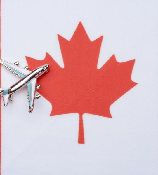 canada-flag-and-the-plane-the-concept-of-travel-free-photo